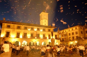 With hands outstretched, the people of Guernica, Spain wait to catch poems raining down on them.