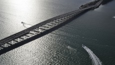"Water Under the Bridge" features the Rickenbacker Causeway, which connects Miami to the barrier islands of Virginia Key and Key Biscayne across Biscayne Bay.