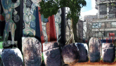 Yasmin Hernandez's augmented digital artwork depicts a Taíno village scene over the courtyard at El Museo del Barrio.