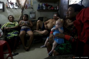 Eight-month-old Aisha Guerrero, who is part of the albino or "Children of the Moon" group in the Guna Yala indigenous community, sits on her Aunt's lap in Panama City, Panama May 9, 2015. REUTERS/Carlos Jasso  SEARCH "JASSO MOON" FOR ALL IMAGES