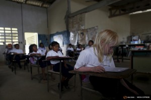 Yaisseth Morales, 11, who is part of the albino or "Children of the Moon" group in the Guna Yala indigenous community, is seen in her classroom at the local school on Ustupu Island in the Guna Yala region, Panama April 27, 2015. REUTERS/Carlos Jasso